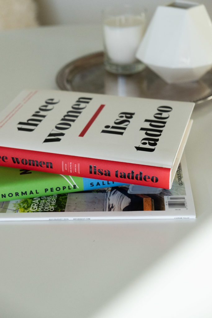 Two Novels, Three Women and Normal People stacked on a table
